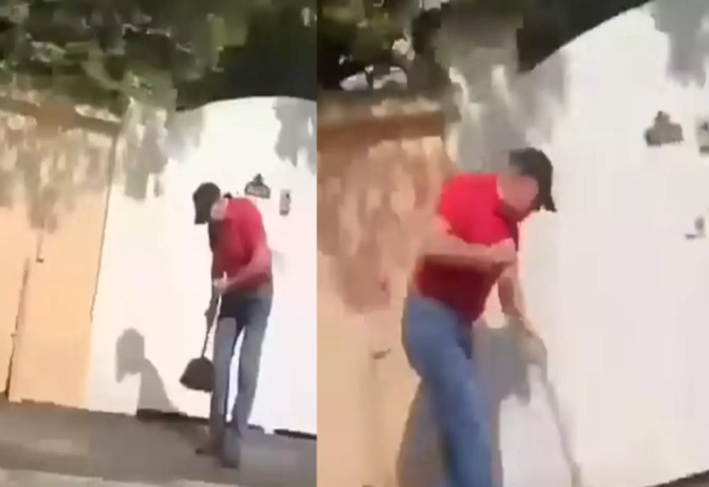 KLAUS IOHANNIS, FILMAT CÂND DĂ CU MĂTURA ÎN FAȚA CASEI SALE DIN SIBIU